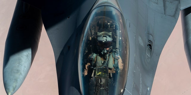 U.S. Air Force F-16 Fighting Falcon is aerial refueled by a KC-135 Stratotanker over the U.S. Central Command area of responsibility Dec. 30, 2020. The B-52 Stratofortress is a long-range, heavy bomber that is capable of flying at high subsonic speeds at altitudes of up to 50,000 feet and can carry nuclear or precision guided conventional ordnance with global reach precision navigation capability. (U.S. Air Force photo by Senior Airman Roslyn Ward)