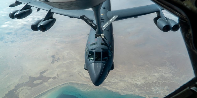 A U.S. Air Force B-52 from Barksdale Air Force Base is aerial refueled by a KC-135 Stratotanker over the U.S. Central Command area of responsibility Dec. 30, 2020. The B-52 Stratofortress is a long-range, heavy bomber that is capable of flying at high subsonic speeds at altitudes of up to 50,000 feet and can carry nuclear or precision guided conventional ordnance with global reach precision navigation capability. (U.S. Air Force photo by Senior Airman Roslyn Ward)