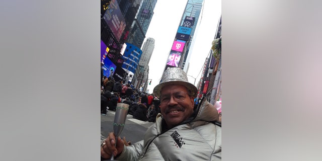Ronald Colbert celebrating New Year's Eve in Times Square, in Manhattan on Dec. 31, 2019. As a longtime reveler, he hopes to return to the square to watch The Ball drop one last time.
