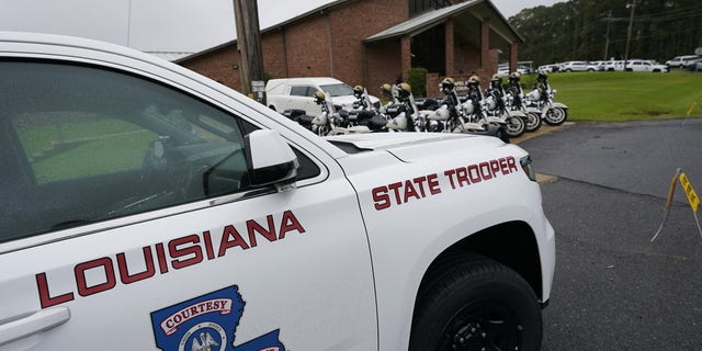 A heavy Louisiana State Police presence is seen at the New Chapel Hill Baptist Church during funeral services for Master Trooper Chris Hollingsworth in West Monroe, La. 
