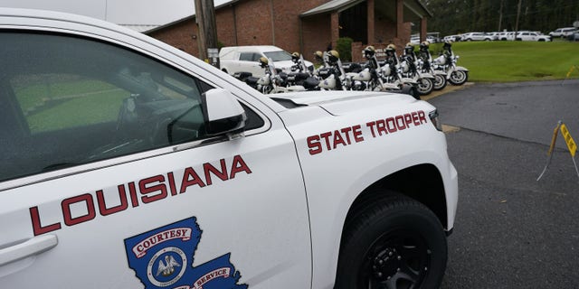 A heavy Louisiana State Police presence is seen at the New Chapel Hill Baptist Church during funeral services for Master Trooper Chris Hollingsworth in West Monroe, La.