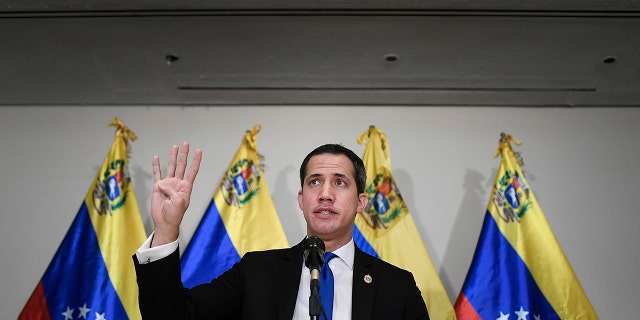 Venezuelan opposition leader Juan Guaido speaks at a press conference in Caracas, Venezuela, Saturday, Dec. 5, 2020, a day before parliamentary elections. (AP Photo/Matias Delacroix)