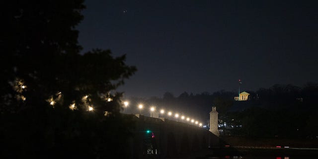 Jupiter, left, and Saturn, right, are seen during the "great conjunction" where the two planets appear a tenth of a degree apart from one another, Monday, Dec. 21, 2020, from Washington, DC. Photo Credit: (NASA/Aubrey Gemignani)