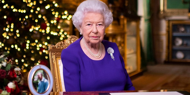 In this undated photo released on Friday, December 25, 2020, British Queen Elizabeth II records her annual Christmas broadcast at Windsor Castle in Windsor, England.