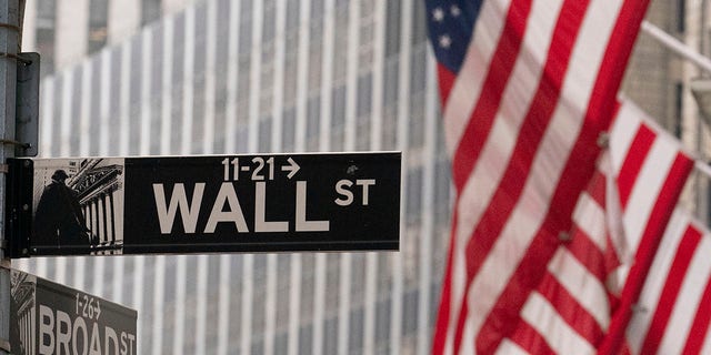 A street sign for Wall Street is seen outside the New York Stock Exchange.