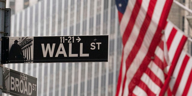 A street sign for Wall Street is seen outside the New York Stock Exchange.