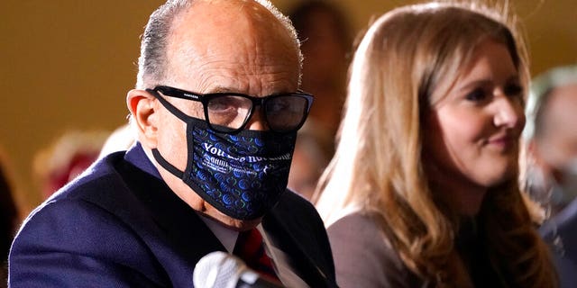 Former New York Mayor Rudy Giuliani, a lawyer for President Donald Trump, is wearing a face mask to protect against COVID-19 after speaking at a hearing in the Pennsylvania State Senate Majority Political Committee on Wednesday, November 25, 2020 in Gettysburg. Pa. (AP photo / Julio Cortez)