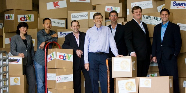 In this May 21, 2008, file photo, Marie J. Toulantis, CEO of Barnes & Noble.com; Tony Hsieh, CEO of Zappos.com; Rob Norman, CEO of GroupM Interaction Worldwide; Bill Gates, Chairman of Microsoft Corp.; Matt Ackley, VP of Internet Marketing and Advertising, eBay Inc.; Patrick Byrne, CEO of Overstock.com; and Jim Barr, President, Online, Sears Holdings, pose for a photo. (AP Photo/Stephen Brashear)
