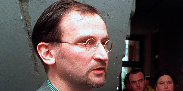 In this file photo dated May 2, 1998, Jozsef Szajer, vice-president of the Fidesz Hungarian Civic Party, talks to the media. The Hungarian member of the European Parliament Jozsef Szajer admitted to being among those present at an illegal party broken up by Belgian police in central Brussels last week, amid press reports he took part in a COVID-19 lockdown sex orgy. (AP photo/Tibor Rozsahegyi, FILE)