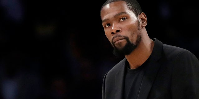 The Brooklyn Nets' Kevin Durant watches during the second half of the team's game against the Los Angeles Lakers in Los Angeles.