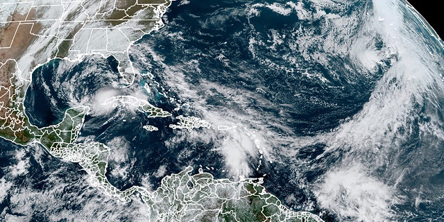 The National Hurricane Center is monitoring four tropical waves in the Atlantic and Caribbean oceans to see if they materialize into storms.