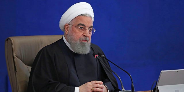 President Hassan Rouhani speaks in a cabinet meeting in Tehran, Iran, Wednesday, Dec. 2, 2020. Rouhani on Wednesday rejected a bill approved by parliament that would have suspended U.N. inspections and boosted uranium enrichment, saying it was "harmful" to diplomatic efforts aimed at restoring the 2015 nuclear deal and easing U.S. sanctions. (Iranian Presidency Office via AP)