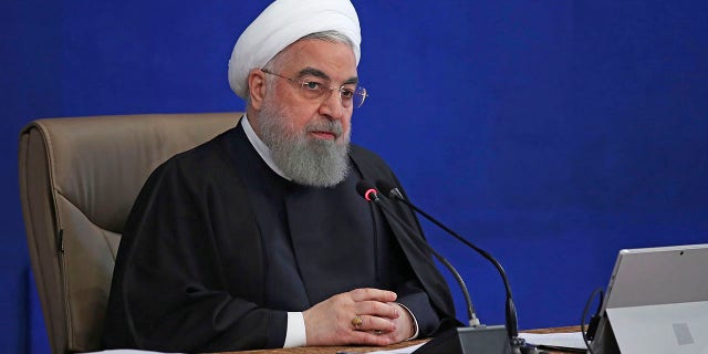 President Hassan Rouhani speaks in a cabinet meeting in Tehran, Iran, Wednesday, Dec. 2, 2020. Rouhani on Wednesday rejected a bill approved by parliament that would have suspended U.N. inspections and boosted uranium enrichment, saying it was "harmful" to diplomatic efforts aimed at restoring the 2015 nuclear deal and easing U.S. sanctions. (Iranian Presidency Office via AP)