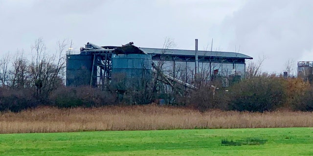 This photo taken with permission from the Twitter feed of @jawadburhan98, shows the building in Bristol, where fire crews, police and paramedics are responding to a "large" explosion, Thursday Dec. 3, 2020. A local emergency services department says fire and rescue workers are responding to a report of a “large” explosion at a port near the southwest England city of Bristol. (@Twitter/jawadburhan98 via AP)