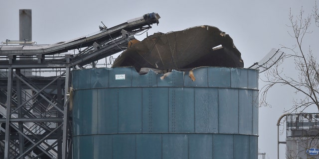 The warehouse where emergency services attend to a large explosion in Bristol, England, Thursday Dec. 3, 2020. A local British emergency services department says there have been “multiple casualties” following a large explosion at a warehouse near the southwest England city of Bristol. (Ben Birchall/PA via AP)