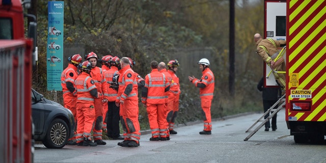Emergency services attend to a large explosion at a warehouse in Bristol, England, Thursday Dec. 3, 2020. A local British emergency services department says there have been “multiple casualties” following a large explosion at a warehouse near the southwest England city of Bristol. (Ben Birchall/PA via AP)