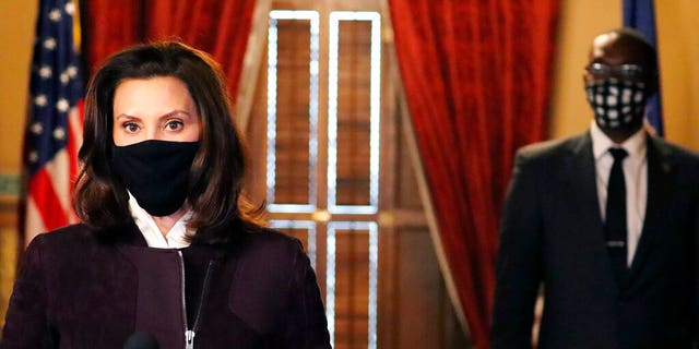 In this photo provided by the Michigan Office of the Governor, Gov. Gretchen Whitmer addresses the state during a speech in Lansing, Mich., Thursday, Dec. 3, 2020. 