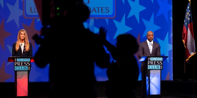 Sen. Kelly Loeffler, left, and Democratic challenger for U.S. Senate Raphael Warnock appear during a debate Sunday, Dec. 6, 2020, in Atlanta. (AP Photo/Ben Gray, Pool)