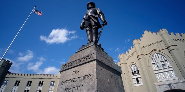 The statue of Gen. Thomas "Stonewall" Jackson stands in front of the barracks on the Virginia Military Institute campus in Lexington, Va., in this Sunday, Sept. 3, 2017, file photo. The Virginia Military Institute began work Monday, Dec. 7, 2020, to remove a prominent statue of Confederate Gen. Thomas “Stonewall” Jackson, an effort initiated this fall after allegations of systemic racism roiled the school. (Bob Brown/Richmond Times-Dispatch via AP)