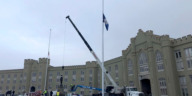 Crews prepare to remove a statue of Confederate Gen. Thomas "Stonewall" Jackson from the campus of the Virginia Military Institute on Monday, Dec. 7, 2020, in Lexington, Va. (AP Photo/Sarah Rankin)