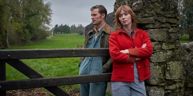 Jamie Dornan (L) and Emily Blunt (R) in a scene from 'Wild Mountain Thyme'.