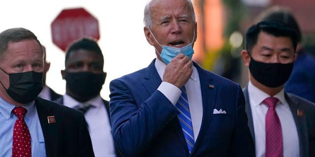 President-elect Joe Biden answers a question as he leaves The Queen theater in Wilmington, Del., Monday, Dec. 7, 2020.