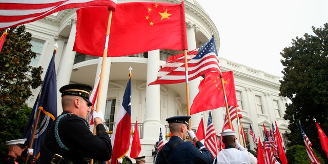 Sept. 25, 2015: A military honor guard await the arrival of Chinese President Xi Jinping for a state arrival ceremony at the White House in Washington. China on Tuesday, Dec. 8, 2020, lashed out at the U.S. over new sanctions against Chinese officials and the sale of more military equipment to Taiwan. (AP Photo/Andrew Harnik)