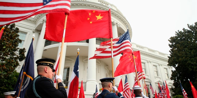 Sept. 25, 2015: A military honor guard await the arrival of Chinese President Xi Jinping for a state arrival ceremony at the White House in Washington. China on Tuesday, Dec. 8, 2020, lashed out at the U.S. over new sanctions against Chinese officials and the sale of more military equipment to Taiwan. (AP Photo/Andrew Harnik)