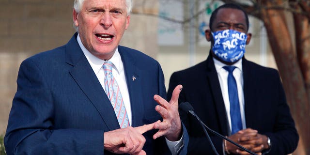 Former Virginia Gov. Terry McAuliffe, left, announces that he is running for the Democratic nomination for governor during a press conference in Richmond, Va., Wednesday, Dec. 9, 2020. (Bob Brown/Richmond Times-Dispatch via AP)