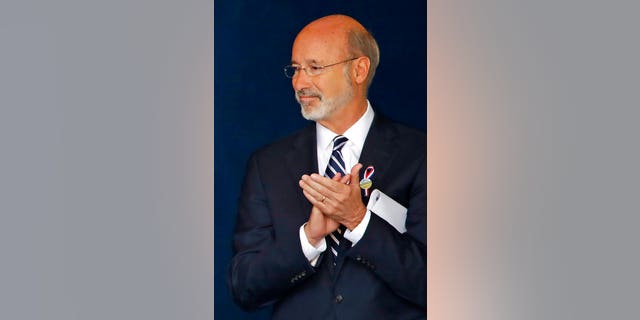 FILE - In this Sept 11, 2018, file photo, Pennsylvania Gov. Tom Wolf attends the September 11th Flight 93 Memorial Service in Shanksville, Pa. Gov. Wolf said Wednesday, Dec. 9, 2020, that he has tested positive for COVID-19 and was isolating at home. (AP Photo/Gene J. Puskar, File)