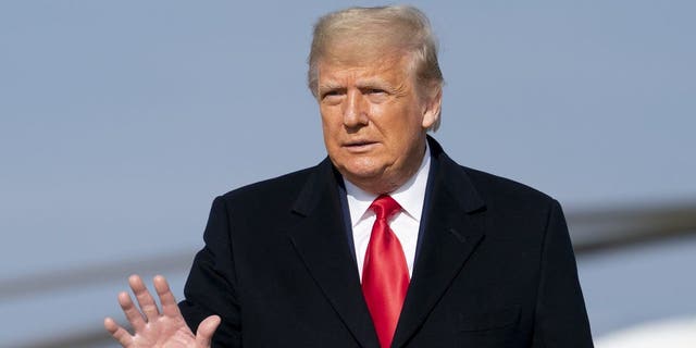 President Donald Trump walks across the tarmac to board Air Force One at in Andrews Air Force Base, Md., Saturday, Dec. 12, 2020, to travel to Michie Stadium at the United States Military Academy to attend the 121st Army-Navy Football Game at West Point, N.Y.