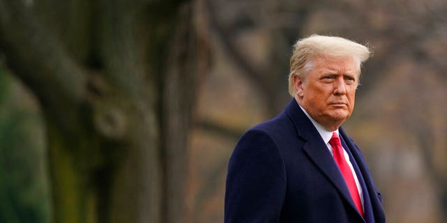 President Donald Trump walks on the South Lawn of the White House in Washington, Dec. 12, before boarding Marine One. Trump went to the Army-Navy Game at the U.S. Military Academy in West Point, N.Y. (AP Photo/Patrick Semansky)