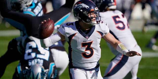 Denver Broncos quarterback Drew Lock passes against the Carolina Panthers during the first half of an NFL football game Sunday, Dec. 13, 2020, in Charlotte, N.C. (AP Photo/Brian Blanco)