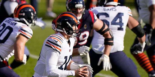 Chicago Bears quarterback Mitchell Trubisky (10) looks to throw during the first half of an NFL football game against the Houston Texans, Sunday, Dec. 13, 2020, in Chicago. (AP Photo/Nam Y. Huh)