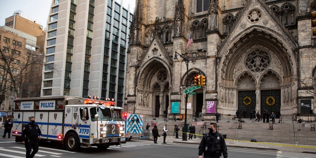 New York police officers block off the scene of a shooting at the Cathedral Church of St. John the Divine, Sunday, Dec. 13, 2020, in New York. (Associated Press)