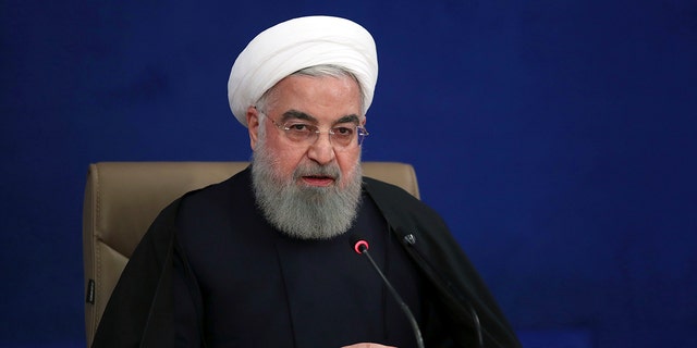 In this photo released by the official website of the office of the Iranian Presidency, President Hassan Rouhani speaks during his press conference in Tehran, Iran, Monday, Dec. 14, 2020. Rouhani on Monday claimed that Israel was behind the killing of a scientist who founded the Islamic Republic’s military nuclear program in the 2000s in an effort to start a war in the last days of President Trump's administration. (Iranian Presidency Office via AP)