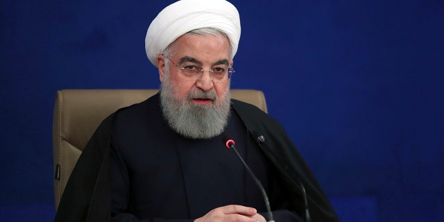 In this photo released by the official website of the office of the Iranian Presidency, President Hassan Rouhani speaks during his press conference in Tehran, Iran, Monday, Dec. 14, 2020. Rouhani on Monday claimed that Israel was behind the killing of a scientist who founded the Islamic Republic’s military nuclear program in the 2000s in an effort to start a war in the last days of President Trump's administration. (Iranian Presidency Office via AP)