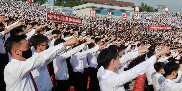 In this June 6, 2020 file photo, North Korean students stage a rally to denounce South Korea following that defectors and other activists in South Korea flew anti-Pyongyang leaflets over the border, at the Pyongyang Youth Park Open-air Theatre in Pyongyang, North Korea.