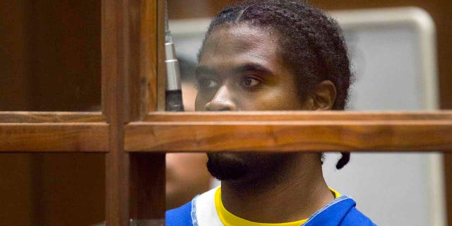 FILE - In this July 24, 2018, file photo, Gene Evin Atkins appears in Los Angeles Superior court in Los Angeles. Atkins was charged with murder in the death of a Trader Joe's store employee who was hit by an officer's bullet during a police gun battle with Atkins. (AP Photo/Damian Dovarganes, File)