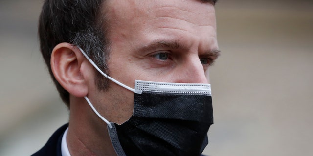 French President Emmanuel Macron reacts as he meets Portuguese Prime Minister Antonio Costa, Wednesday, Dec. 16, 2020 in Paris. (Associated Press)