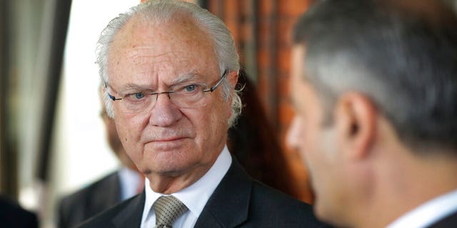 FILE: Sweden's King Carl XVI Gustaf talks to invitees during a round table dialogue on tracking air pollution and adopting circular economy approaches in New Delhi, India. 