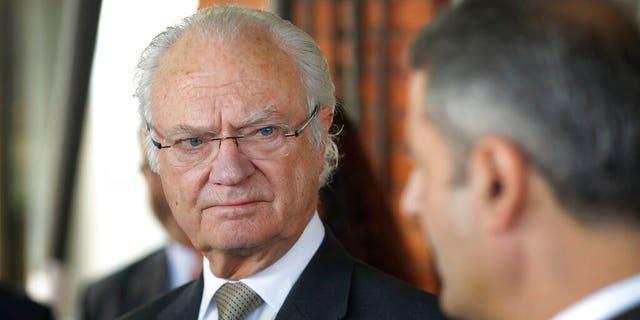 FILE: Sweden's King Carl XVI Gustaf talks to invitees during a round table dialogue on tracking air pollution and adopting circular economy approaches in New Delhi, India.