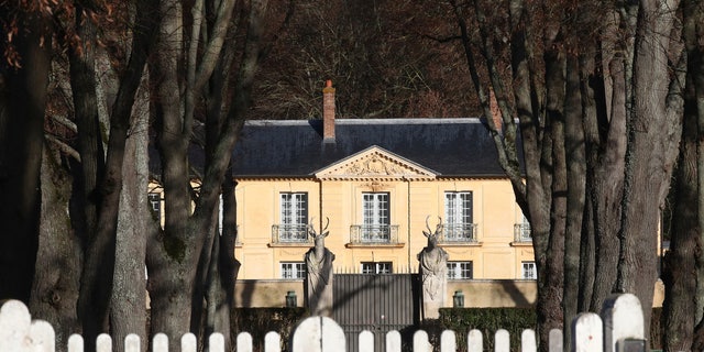 La Lanterne, a presidential residence in Versailles, outside Paris, is pictured Friday, Dec. 18, 2020 in Paris. As French President Emmanuel Macron rides out the coronavirus in a presidential retreat at Versailles, French doctors are warning families who are heading for the holidays to remain cautious because of an uptick in infections — especially at the dinner table. (AP Photo/Michel Euler)