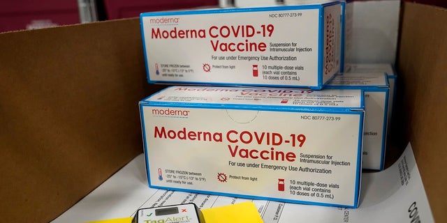 Boxes containing the Moderna COVID-19 vaccine are prepared to be shipped at the McKesson distribution center in Olive Branch, Miss., Dec. 20. (AP Photo/Paul Sancya, Pool)