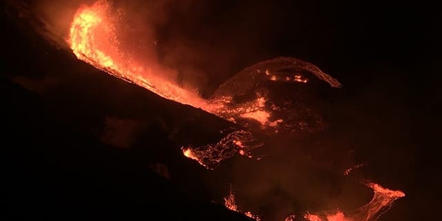 In this photo provided by the U.S. Geological Survey, lava flows within the Halema’uma’u crater of the Kilauea volcano Sunday, Dec. 20, 2020. The Kilauea volcano on Hawaii’s Big Island has erupted, the U.S. Geological Survey said. (U.S. Geological Survey via AP)