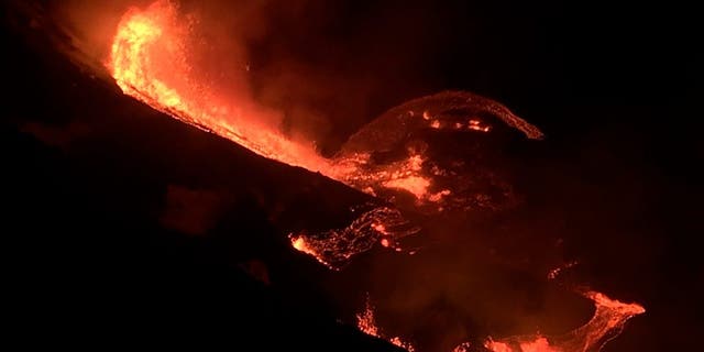 In this photo provided by the U.S. Geological Survey, lava flows within the Halema’uma’u crater of the Kilauea volcano Sunday, Dec. 20, 2020. The Kilauea volcano on Hawaii’s Big Island has erupted, the U.S. Geological Survey said. (U.S. Geological Survey via AP)