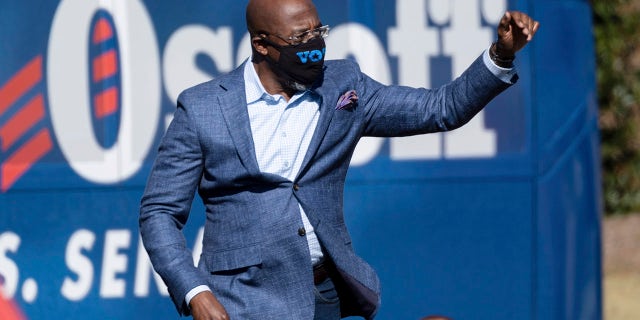 Democratic U.S. Senate challenger the Rev. Raphael Warnock during a rally Monday, Dec. 21, 2020, in Columbus, Ga., with Vice President-Elect Kamala Harris and fellow Democratic U.S. Senate challenger Jon Ossoff. (AP Photo/Ben Gray)