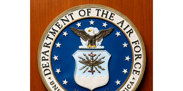 FILE - This Friday, August 10, 2007, the file image shows the logo of the Department of the US Air Force at the United States Embassy in Berlin.  A new report released on Monday, December 21, 2020 on racial differences in the Air Force concludes that black service members in the service are far more likely to be investigated, arrested, subjected to disciplinary action and discharged for misdemeanor.  (AP Photo / Michael Sohn, File)