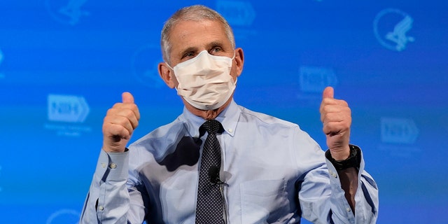 Dr. Anthony Fauci, director of the National Institute of Allergy and Infectious Diseases, gestures after receiving his first dose of the COVID-19 vaccine at the National Institutes of Health, Tuesday, Dec. 22, 2020, in Bethesda, Md. (AP Photo/Patrick Semansky, Pool)