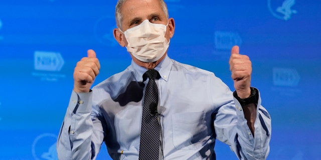 Dr. Anthony Fauci, director of the National Institute of Allergy and Infectious Diseases, gestures after receiving his first dose of the COVID-19 vaccine at the National Institutes of Health, Tuesday, Dec. 22, 2020, in Bethesda, Md. (AP Photo/Patrick Semansky, Pool)